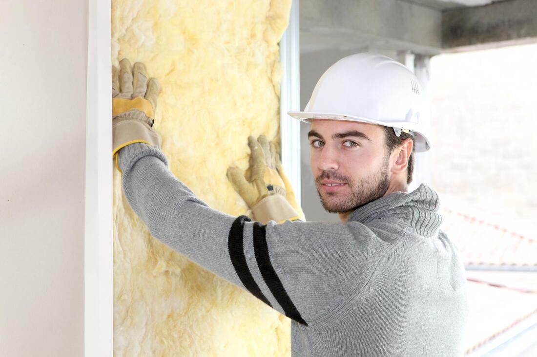 worker holding the insulation